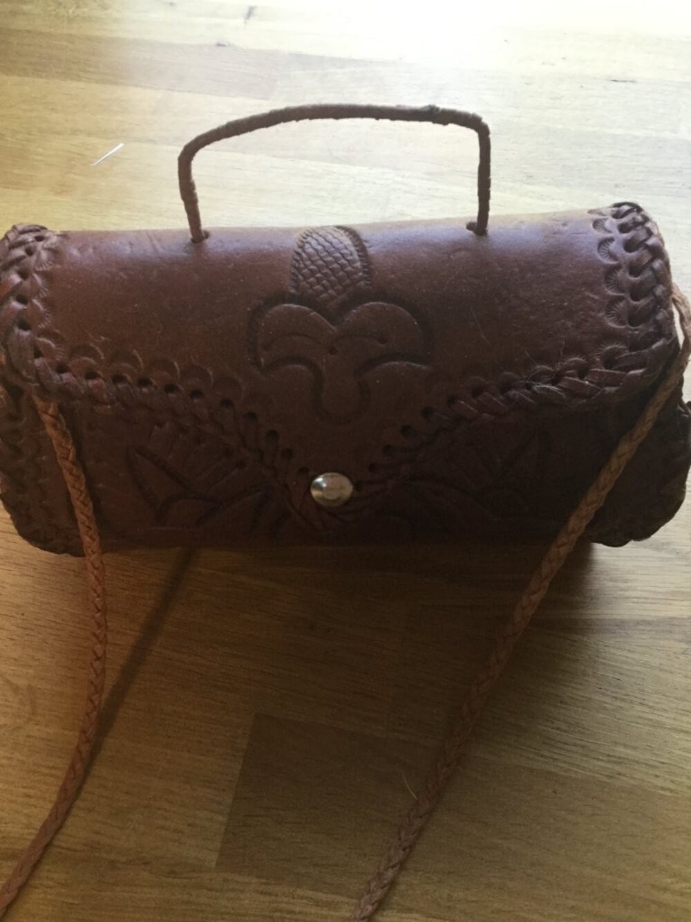 Hand made tooled leather purse still leather braided strap covered wire handle